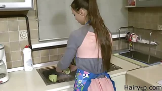 young wife near kitchen