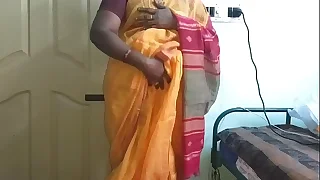desi  indian horny tamil telugu kannada malayalam hindi cheating wife vanitha wearing orange diagonal saree  showing big boobs and shaved pussy press indestructible boobs press nip fretting pussy masturbation