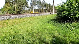 Whipping naked breasts at the railway station