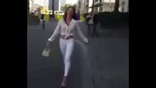 7321620 bawd strolling in the street in sexy high heels and legging