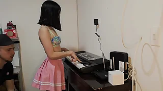 Sexy and hot Laura in skirt wants to learn to play the piano